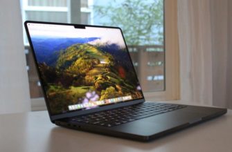 An open MacBook Pro on a table.