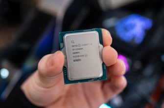 Intel Core i9-13900K held between fingertips.