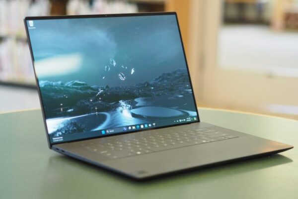 Dell XPS 16 front angled view showing display and keyboard. Dell XPS 16 front angled view showing display and keyboard.