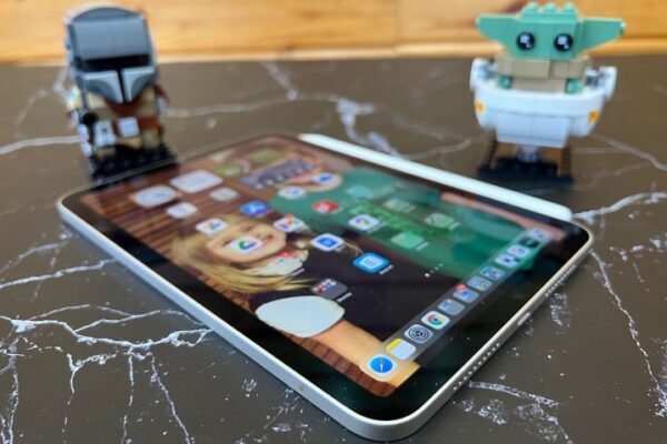 The iPad Mini placed at an angle on a desk to show off its screen. The iPad Mini placed at an angle on a desk to show off its screen.