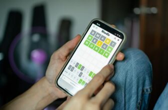 Someone playing Wordle on a smartphone.
