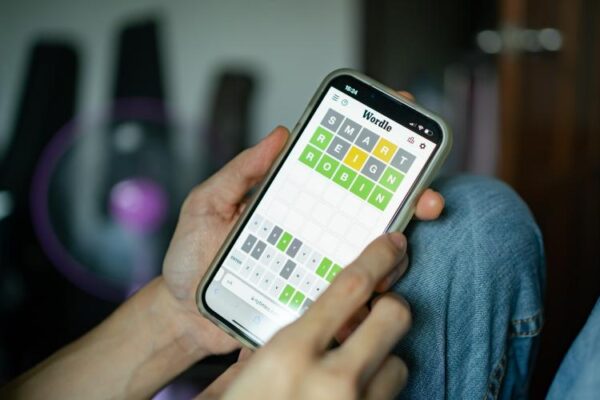 Someone playing Wordle on a smartphone. Someone playing Wordle on a smartphone.