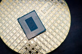 A Core i9-12900KS processor sits on its box.