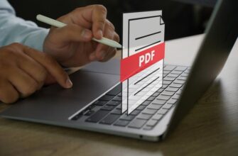 Человек использует ноутбук с проекцией иконки PDF на экране