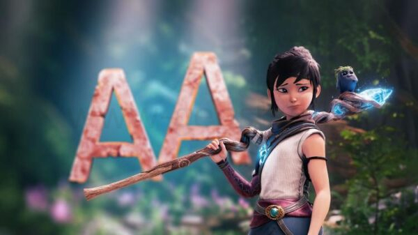 Главный герой игры 'Kena: Bridge of Spirits' с размытым изображением 'AA' на заднем фоне.
