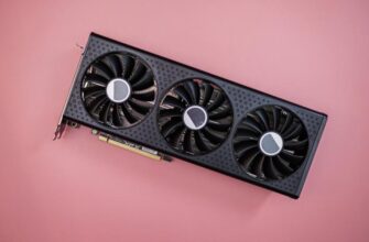 Графическая карта RX 7600 XT на розовом фоне.