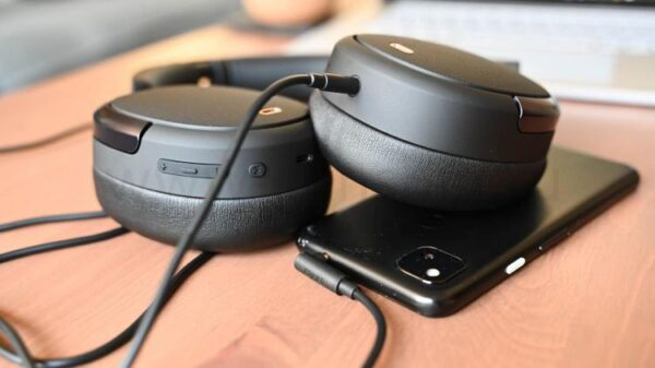 Edifier WH950NB using wired mode by having an AUX cord plugged into the headphones and a phone.