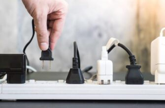 A power board with AC plugs and DC adapters in the sockets.