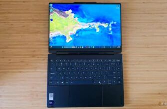 The Lenovo Yoga 9i 2-in1 Gen10 laptop lying flat on a desk.