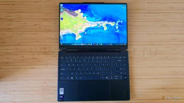 The Lenovo Yoga 9i 2-in1 Gen10 laptop lying flat on a desk.