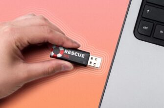 Hand inserting a USB flash drive labeled 'Rescue SOS' into a laptop.