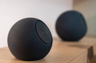 Amazon Echo Dot Max and Studio sitting on a shelf.