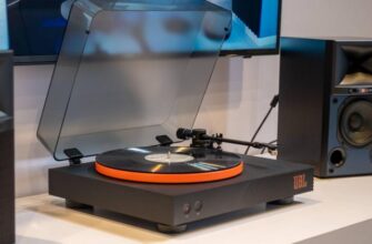 A vinyl record player with speakers.
