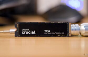 The Crucial T710 NVMe SSD propped up on a desk by a metal screwdriver.