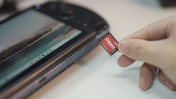 A person holding a Biwin Mini SSD. 