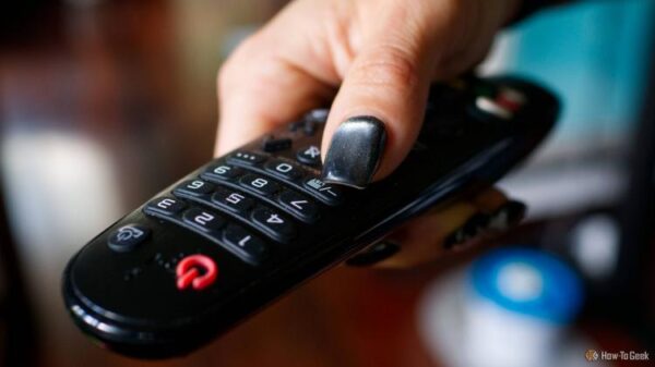 A person holding an infrared TV remote.