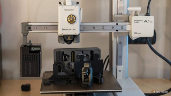 Bambu Labs A1 mini 3D printer with 3D printed components sitting on the build plate.