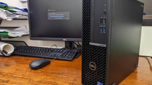 A Dell office PC sits on a desk.