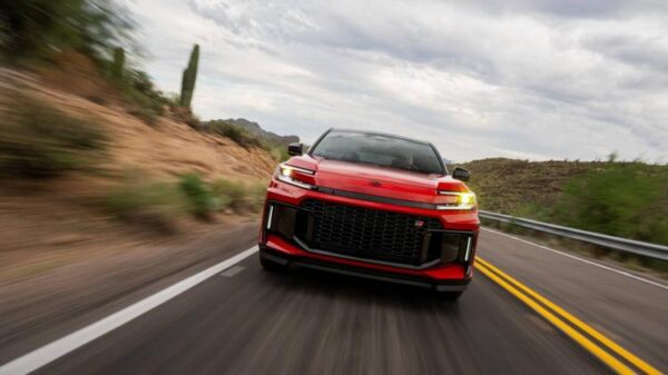 Head-on action shot of a 2026 Toyota RAV4 PHEV GR Sport