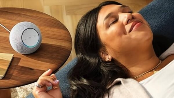 Echo Dot Max on a table near a person laying down