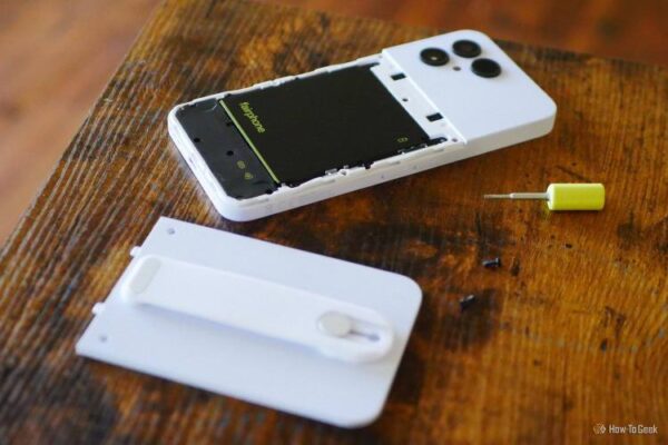 A Fairphone 6 with backplate and screws removed.