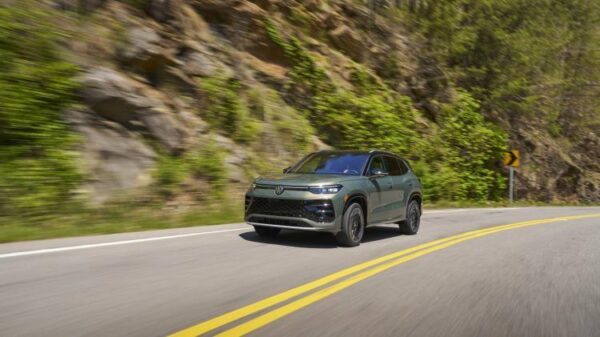 Front 3/4 action shot of a 2026 Volkswagen Tiguan 