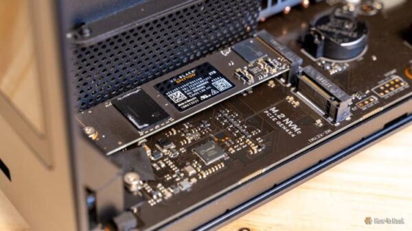 A close-up of the WD Black SN7100 2TB NVMe SSD seated in an M.2 slot on the Ugreen iDX6011 Pro NAS.