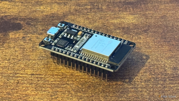An ESP32 microcontroller on a desk.