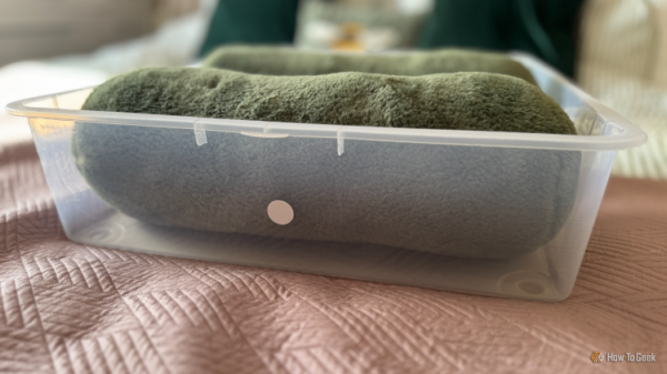 A storage bin with an NFC tag stuck to the outside of it.