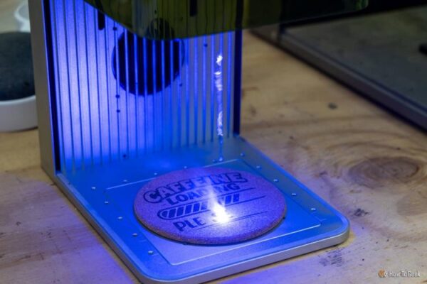 xTool F1 10W blue diode laser engraving Caffeine Loading on a cork coaster.